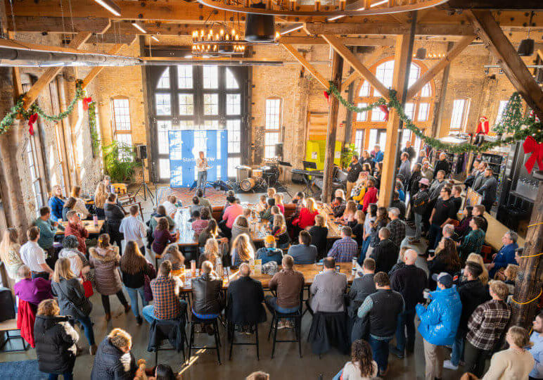 crowd gathered at StartupBrew